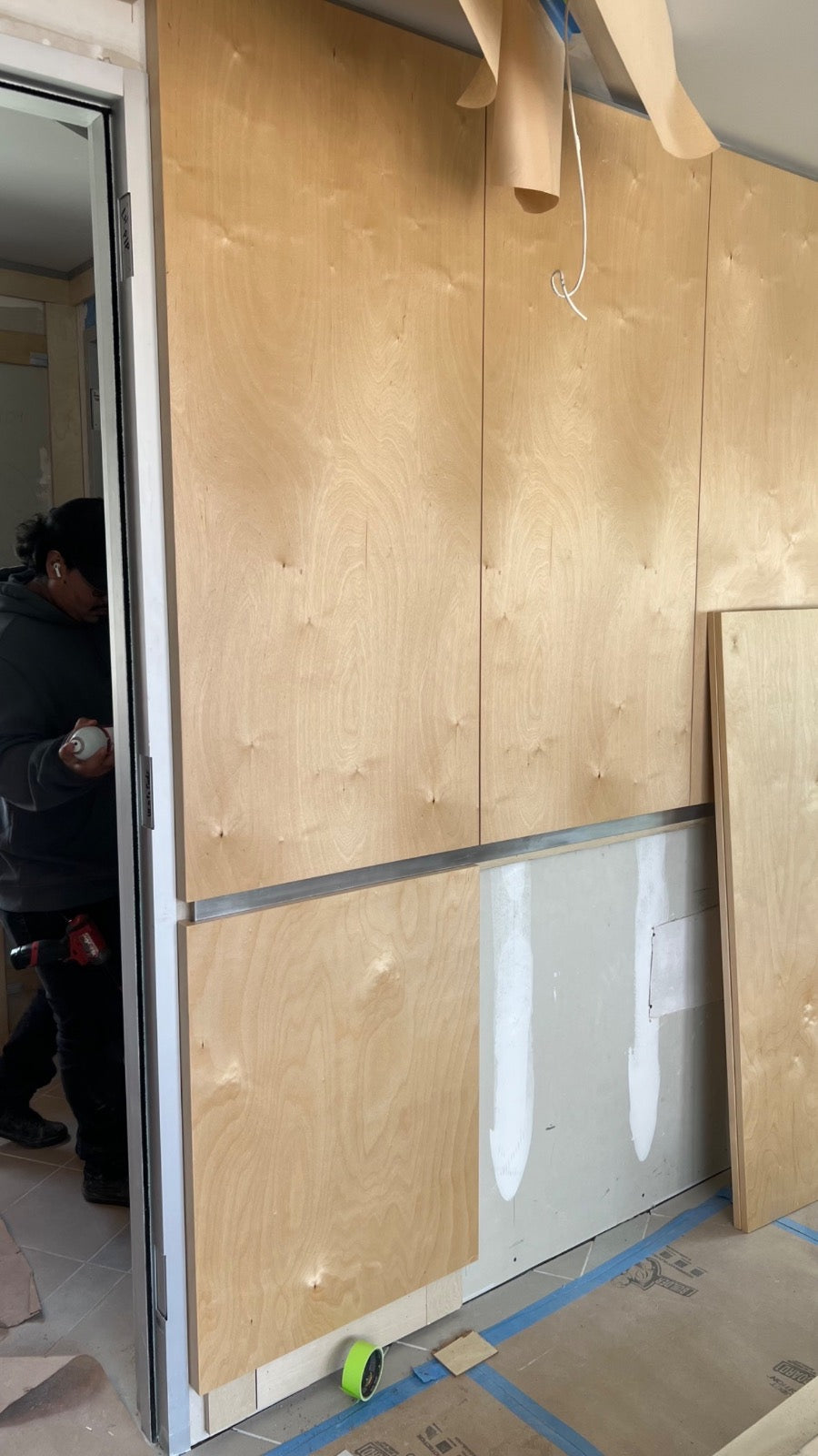 Finished birch plywood wall panels with steel reveal